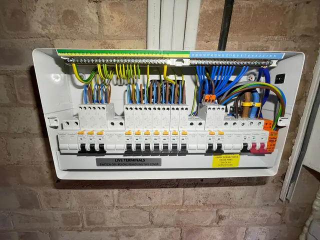 Consumer unit upgrade on a brick wall